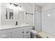 Modern bathroom features a double sink vanity, decorative mirrors, and subway-tiled shower at 8216 Glenwillow Ln # 104, Indianapolis, IN 46278