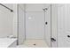The modern bathroom showcases a sleek, tiled shower with black accents and a glass enclosure at 8216 Glenwillow Ln # 104, Indianapolis, IN 46278