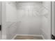 Spacious walk-in closet featuring extensive wire shelving for optimal organization at 8216 Glenwillow Ln # 104, Indianapolis, IN 46278