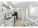 Modern kitchen features granite countertops, stainless sink, and white subway tile backsplash at 8216 Glenwillow Ln # 104, Indianapolis, IN 46278