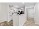 Modern kitchen featuring sleek white cabinets, stainless steel appliances, and stylish countertops at 8216 Glenwillow Ln # 104, Indianapolis, IN 46278