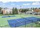 Tennis and basketball courts offer a place to play near residential buildings at 8216 Glenwillow Ln # 104, Indianapolis, IN 46278