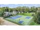 A tennis and basketball court offer recreational opportunities near residential buildings at 8216 Glenwillow Ln # 104, Indianapolis, IN 46278