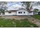 Charming ranch-style home featuring white siding, a brown roof, and well-maintained landscaping at 829 Washington Ave, Cicero, IN 46034