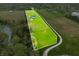 Overhead photo featuring a large lot, home, pond and lush trees at 8850 W 225 S, Columbus, IN 47201