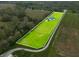Aerial view of property including pond, lush landscaping, long drive and home at 8850 W 225 S, Columbus, IN 47201
