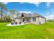 Well-maintained backyard with a large patio area and outdoor seating at 8850 W 225 S, Columbus, IN 47201