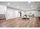 Finished basement featuring vinyl flooring, neutral walls, with stairs to the upper levels at 8850 W 225 S, Columbus, IN 47201