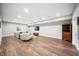 Spacious finished basement with vinyl floors, recessed lighting, and comfortable seating area at 8850 W 225 S, Columbus, IN 47201