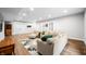 Finished basement featuring vinyl flooring, a cozy seating area, and neutral colors at 8850 W 225 S, Columbus, IN 47201