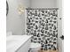 Bright bathroom featuring white vanity, a gold deer head, and shower with playful animal print curtain at 8850 W 225 S, Columbus, IN 47201