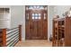 Elegant entryway featuring a craftsman-style wooden door and decorative accents at 8850 W 225 S, Columbus, IN 47201