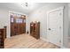 Welcoming entryway featuring a craftsman-style door and a vintage cabinet for storage at 8850 W 225 S, Columbus, IN 47201