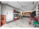 Garage featuring a utility rack, tool rack, shelving, and a buggy at 8850 W 225 S, Columbus, IN 47201