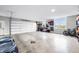 Spacious garage with multiple windows, bike rack, and epoxy floor at 8850 W 225 S, Columbus, IN 47201