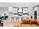 Modern kitchen with white cabinets, a spacious island, and stainless steel appliances at 8850 W 225 S, Columbus, IN 47201