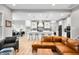 Stylish kitchen showcasing a large island with seating and an open view of the living area at 8850 W 225 S, Columbus, IN 47201