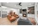 Stylish living room with a stone fireplace, a comfortable sofa, and open floor plan at 8850 W 225 S, Columbus, IN 47201