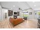 Cozy living room with a stone fireplace, built-in shelving, and ample seating at 8850 W 225 S, Columbus, IN 47201