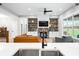Cozy living room showcases a stone fireplace, built-in shelving, and a comfortable leather couch at 8850 W 225 S, Columbus, IN 47201