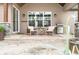 Covered porch with patio seating and a stainless steel grill at 8850 W 225 S, Columbus, IN 47201