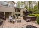 An inviting back patio featuring a fire pit, hot tub, and comfortable seating area at 8901 Shetland Ln, Indianapolis, IN 46278