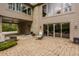 A serene back patio with stone pavers and a cozy seating arrangement at 8901 Shetland Ln, Indianapolis, IN 46278
