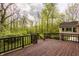 Exterior deck view overlooking lush greenery with stairs and trees at 8901 Shetland Ln, Indianapolis, IN 46278