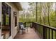A cozy deck offers a serene outdoor space with forest views at 8901 Shetland Ln, Indianapolis, IN 46278