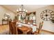 This dining room showcases a chandelier, a decorative wall clock and a view of the home's interior at 8901 Shetland Ln, Indianapolis, IN 46278