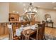 The dining area features a decorative chandelier and overlooks the kitchen and living room at 8901 Shetland Ln, Indianapolis, IN 46278