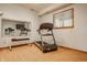 Bright exercise room featuring a treadmill, bench, and mirror, perfect for staying active at home at 8901 Shetland Ln, Indianapolis, IN 46278