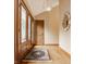 Elegant foyer features hardwood floors, a stylish mirror, and a decorative rug, creating a welcoming entrance at 8901 Shetland Ln, Indianapolis, IN 46278