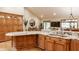 This kitchen island features granite countertops, wood cabinets and a wine rack at 8901 Shetland Ln, Indianapolis, IN 46278