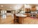 Spacious kitchen with a large island, granite countertops, stainless steel appliances, and hardwood flooring at 8901 Shetland Ln, Indianapolis, IN 46278