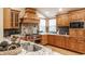 Gourmet kitchen with custom cabinets, stainless steel appliances, granite counters, and a stylish tile backsplash at 8901 Shetland Ln, Indianapolis, IN 46278