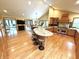 A gourmet kitchen and a large island with stool seating are open to the home's dining area at 8901 Shetland Ln, Indianapolis, IN 46278