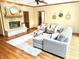 Inviting living room with a stone fireplace, hardwood floors, and comfortable seating arrangements at 8901 Shetland Ln, Indianapolis, IN 46278