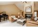 Elegant living room with a fireplace, grand piano, and comfortable leather furniture at 8901 Shetland Ln, Indianapolis, IN 46278