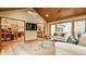Open living room with hardwood floors, comfortable seating, and open access to the kitchen at 8901 Shetland Ln, Indianapolis, IN 46278