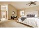 Lovely carpeted primary bedroom featuring a vaulted ceiling, bright windows, and luxury accents at 8901 Shetland Ln, Indianapolis, IN 46278