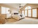 Sun-filled bedroom with vaulted ceiling, French doors, and a luxurious upholstered headboard at 8901 Shetland Ln, Indianapolis, IN 46278