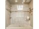 Large tiled shower area features bench and shelf perfect for toiletries and a relaxing experience at 8901 Shetland Ln, Indianapolis, IN 46278