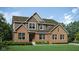 New two story home displaying beautiful brick and siding, professionally landscaped at 9149 Rockville Pl, McCordsville, IN 46055