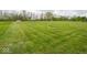 Sprawling backyard with manicured lawn at 9243 Compton Farm Ln, Indianapolis, IN 46259