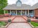 Spacious deck with seating areas and access to the beautifully landscaped backyard at 9243 Compton Farm Ln, Indianapolis, IN 46259