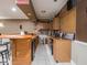 Wide angle view of basement bar showing the serving and cleanup areas plus tile flooring and sports decorations at 9243 Compton Farm Ln, Indianapolis, IN 46259