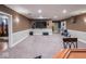 Spacious finished basement with a large screen TV, neutral carpet, and ample room for entertaining at 9243 Compton Farm Ln, Indianapolis, IN 46259