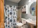 Cozy bathroom featuring a shower and tub combination and pedestal sink at 9243 Compton Farm Ln, Indianapolis, IN 46259