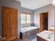 This is a bathroom with a tub, dual sinks, and neutral gray walls at 9243 Compton Farm Ln, Indianapolis, IN 46259